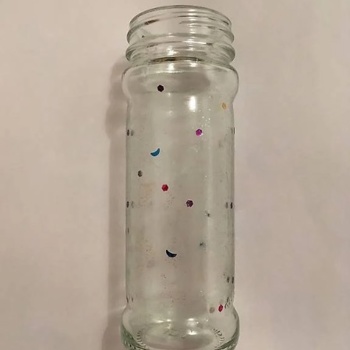 Glasvase mit farbglitzer